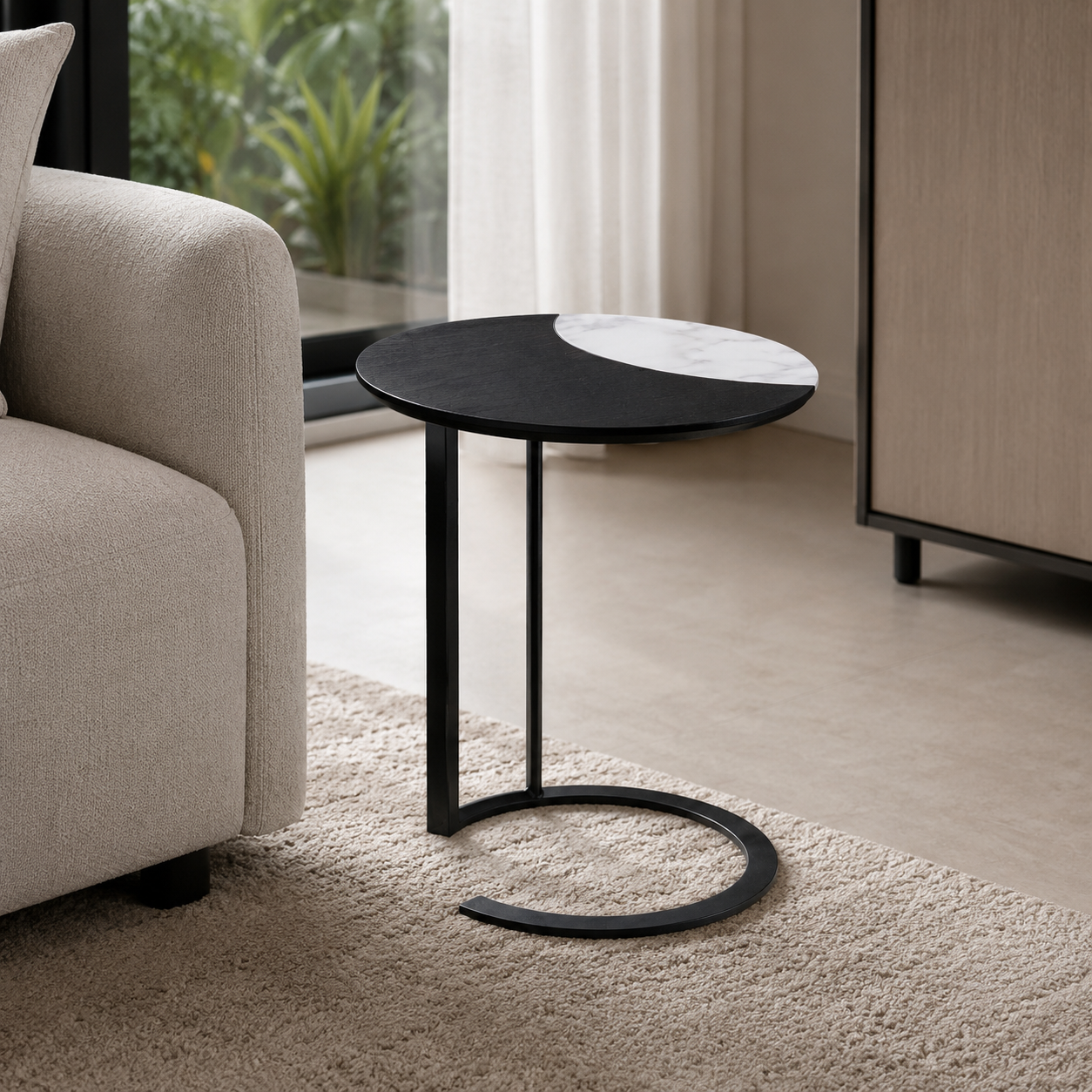 Modern side table with black base and white top in a living room setting.