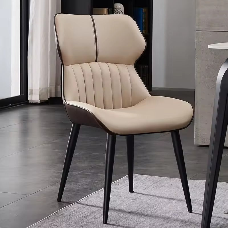 Beige chair with black legs in a modern interior setting