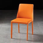 Orange chair on a gray floor with a black background
