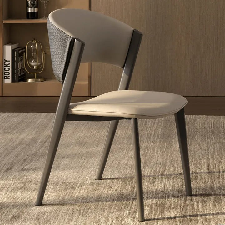 Modern chair with a neutral color scheme on a carpeted floor.