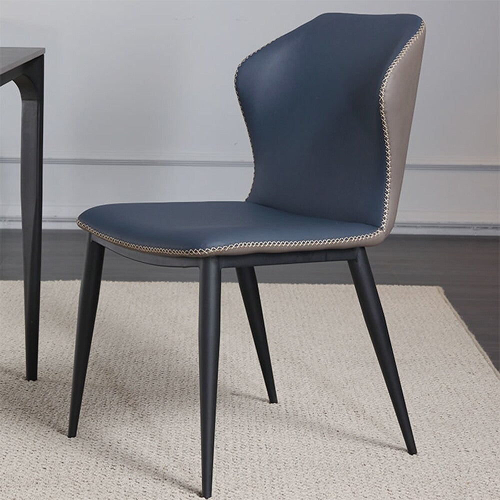 Modern chair with blue cushioned seat and backrest on a neutral background