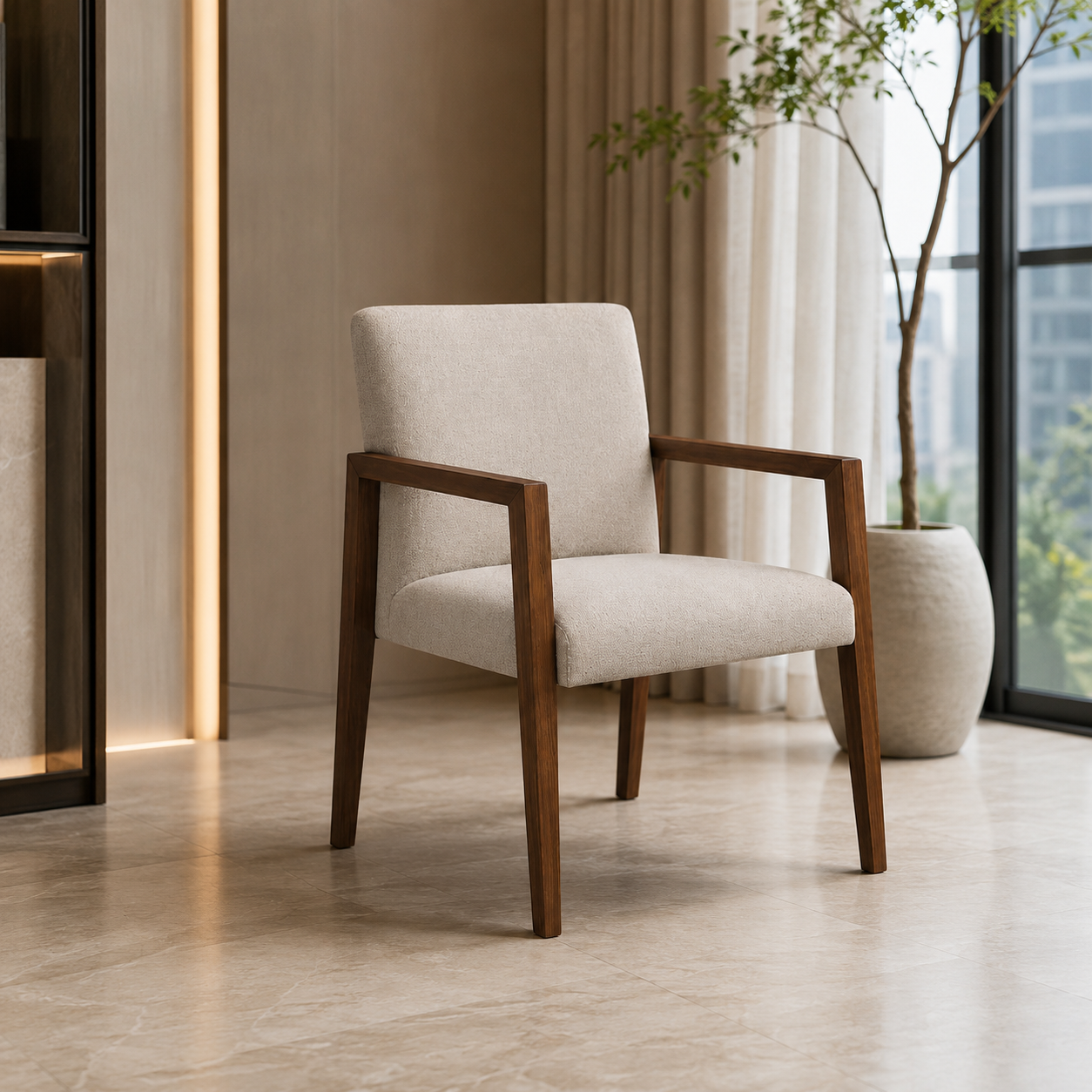 A modern upholstered accent chair with a light beige fabric seat and backrest and dark brown wooden arms and legs, shown in a styled interior setting with a potted plant and curtains.