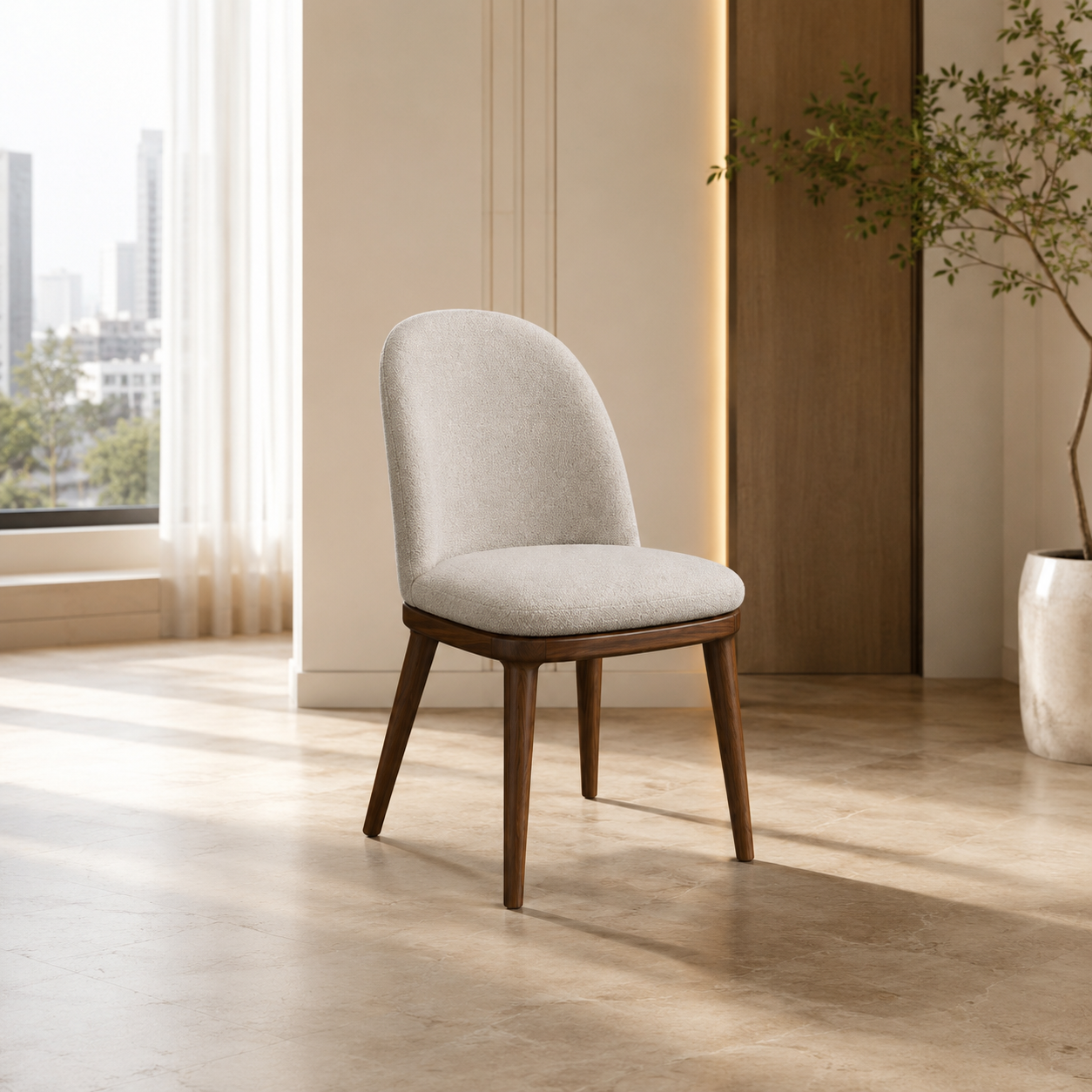 A modern dining chair with a light beige textured fabric seat and curved backrest, supported by dark brown wooden legs, shown in a bright, contemporary room with a window and potted plant.