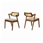 Two wooden chairs with woven backrests and white cushions on a white background