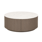 A round coffee table with a white marble top and a fluted metallic bronze-brown base, shown on a plain white background.