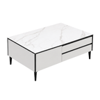 A modern rectangular coffee table with a white marble-patterned top, white side panels, two front drawers with black handles, and slim black legs, shown on a plain white background.