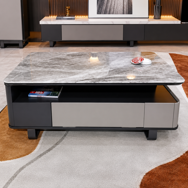 Modern coffee table with marble top and storage compartments in a living room setting.