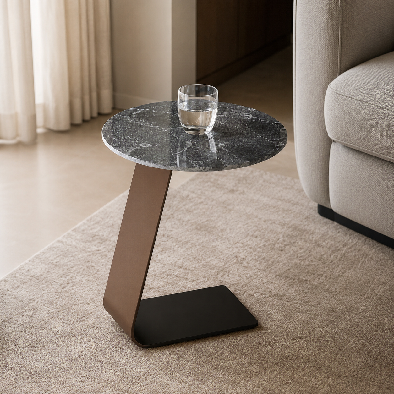 Modern side table with marble top and black base in a living room setting