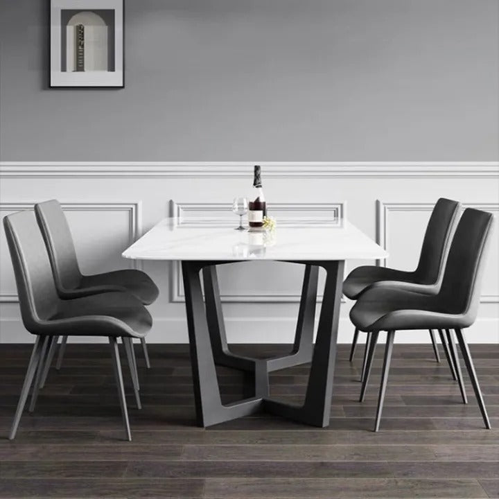 Dining room with a modern table and chairs in a stylish interior.