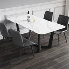 Dining table with chairs in a room with wainscoting