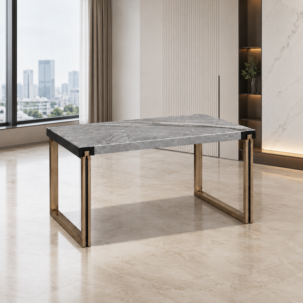 A modern rectangular dining table with a gray marble-patterned top and brushed gold metal legs, shown in a bright contemporary room with a city view.