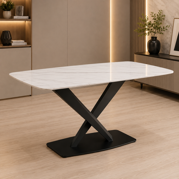 A modern rectangular dining table with a white marble-look top and a black X-shaped metal base, shown in a contemporary interior room with light wood flooring and beige walls.