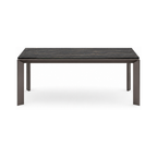 Rectangular dining table with dark marble top and bronze legs on a white background